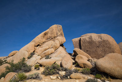 Rock formations against blue sky