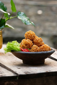 Close-up crispy noodle balls served on table