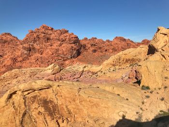 Rock formations in desert against clear sky