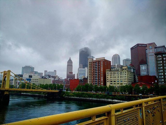 architecture, built structure, building exterior, city, skyscraper, sky, cityscape, water, river, modern, office building, cloud - sky, urban skyline, bridge - man made structure, tall - high, tower, railing, capital cities, city life, financial district