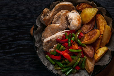 High angle view of fruits in plate on table