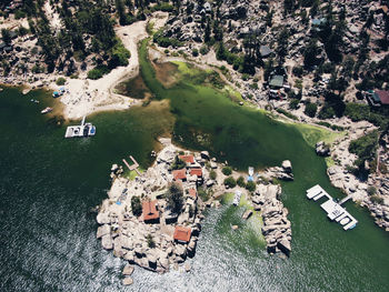 High angle view of buildings by lake