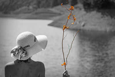 Close-up of leaf against lake