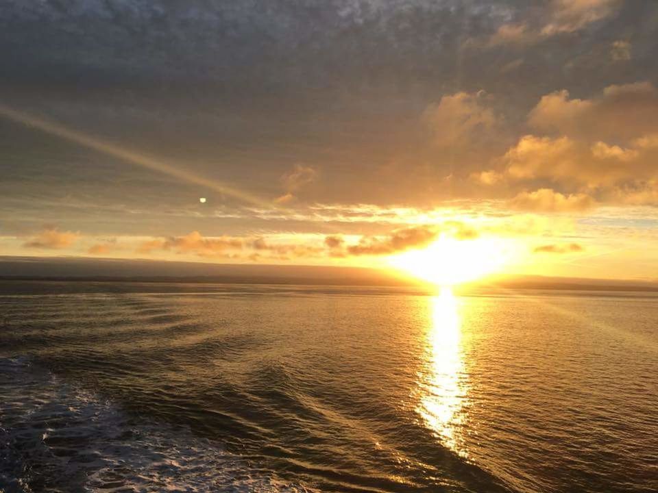 sky, scenics - nature, sunset, water, sea, beauty in nature, tranquility, tranquil scene, horizon, cloud - sky, horizon over water, sun, orange color, sunlight, idyllic, reflection, waterfront, nature, no people, lens flare, outdoors