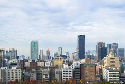 Modern buildings in city against sky