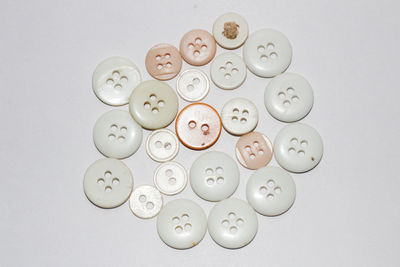 High angle view of coins on white background