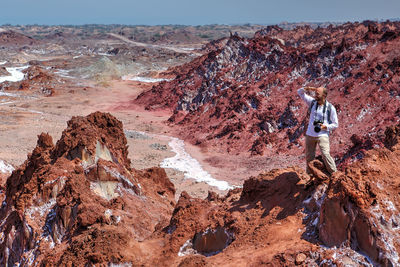 Man standing on rock formations