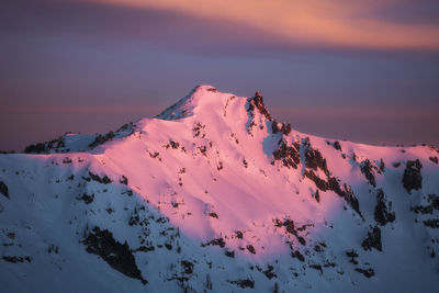 Scenic view of snow covered mountain against sky during sunset