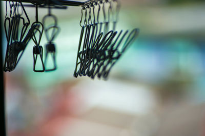 Close-up of clothespins on clothesline