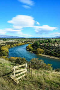 Scenic view of landscape against blue sky