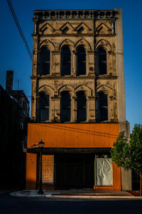 Low angle view of a 1890'1890's building against sky in a small city