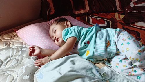 Cute baby sleeping in bed