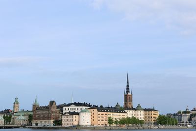 View of city against cloudy sky