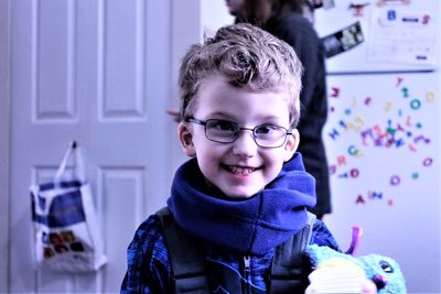 Portrait of smiling boy at home