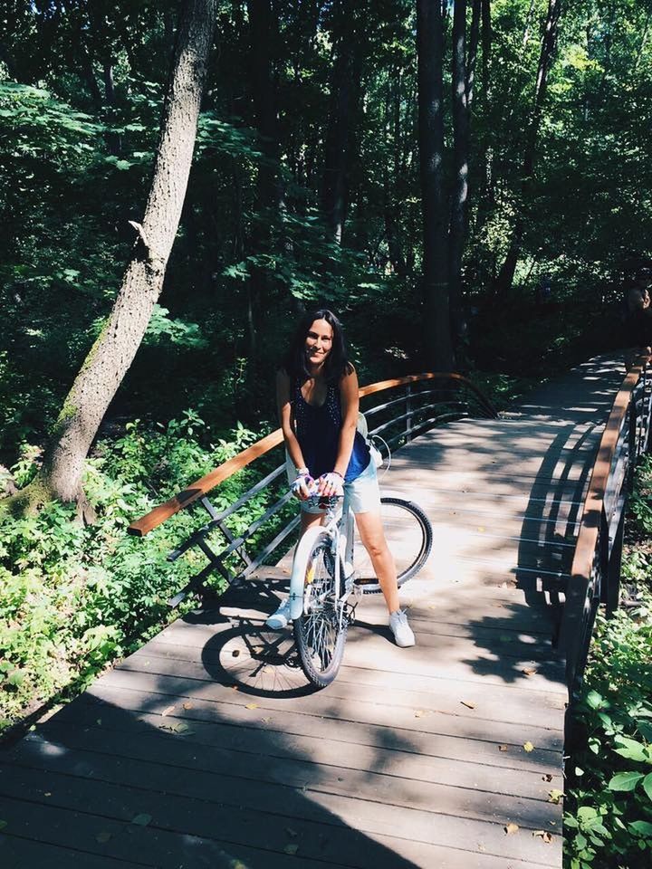 tree, lifestyles, full length, leisure activity, bicycle, person, casual clothing, young adult, transportation, sunlight, mode of transport, land vehicle, young women, shadow, tree trunk, looking at camera, portrait, front view