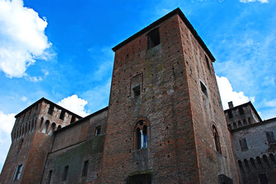 Low angle view of old building against sky