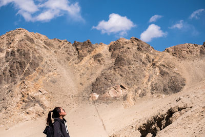 Woman against mountains