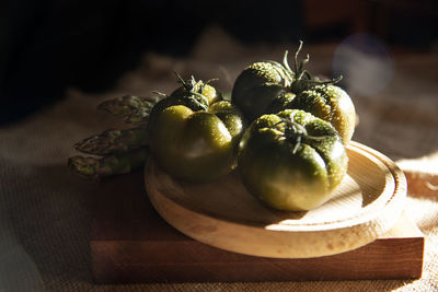 Close-up of fruits in plate on table