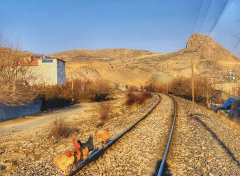 View of railroad tracks against clear sky