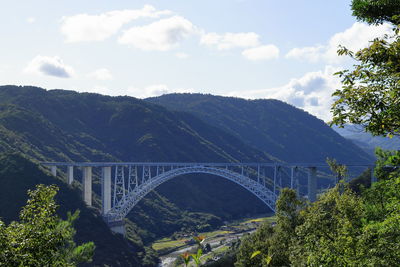 Arch bridge against sky