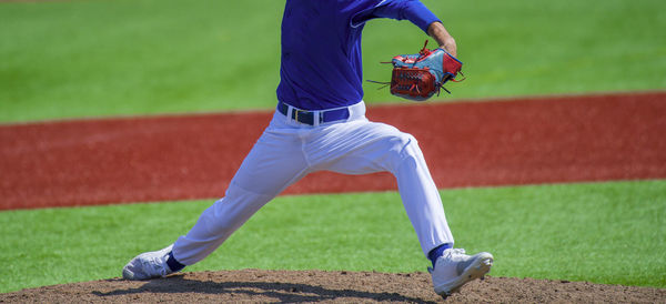 Low section of man playing baseball