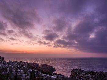Scenic view of sea against sky at sunset