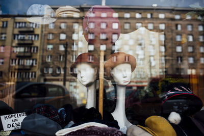 Reflection of building on store window