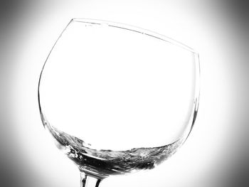 Close-up of wine glass against white background