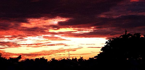 Low angle view of cloudy sky at sunset