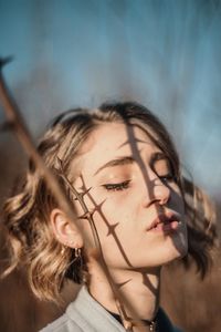 Portrait of young woman looking away