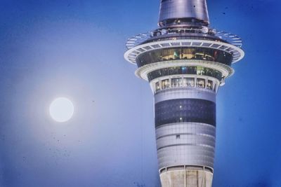 Low angle view of communications tower against sky