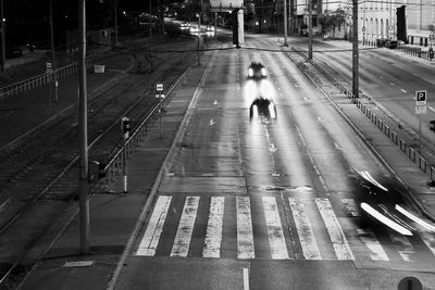People walking on road in city at night