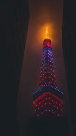 Low angle view of illuminated building at night