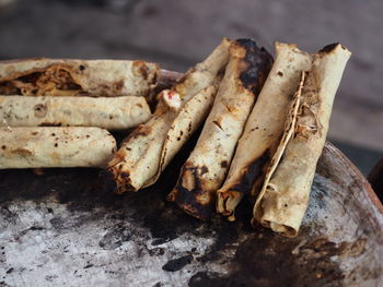 High angle view of rolled flatbreads on wood