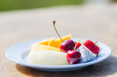 Close-up of fruits in plate on table