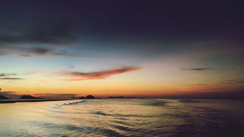 Scenic view of sea against dramatic sky