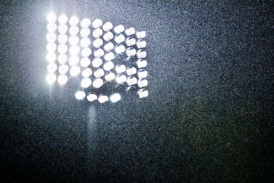 High angle view of light bulbs in the dark