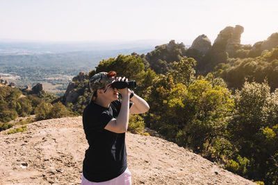 Woman photographing through camera