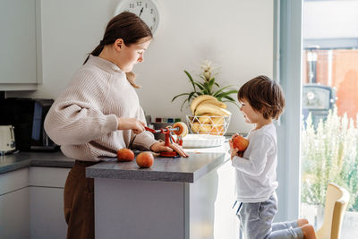 Boy and son on table at home