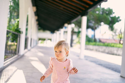 Portrait of girl standing outdoors