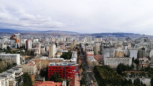 Aerial view of cityscape against sky