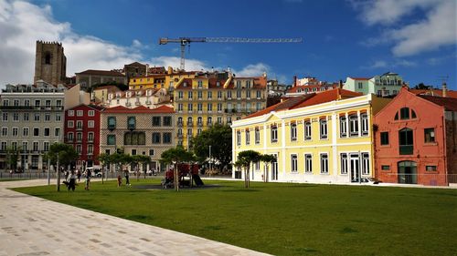 Buildings in city against sky