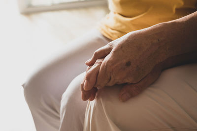 Close-up of woman hand at home