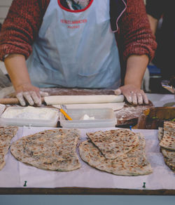 Midsection of man preparing food