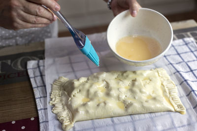 High angle view of woman preparing food on table