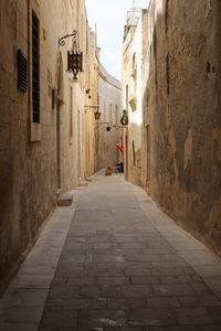 Narrow alley along buildings