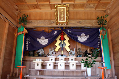 Low angle view of flags hanging in building