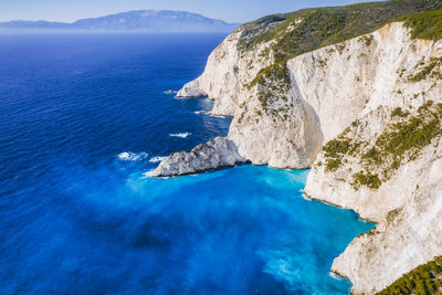 Aerial view of limestone cliffs close to navagio or shipwreck beach on zakynthos island, greece.