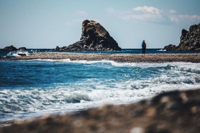 Scenic view of sea against sky on sunny day