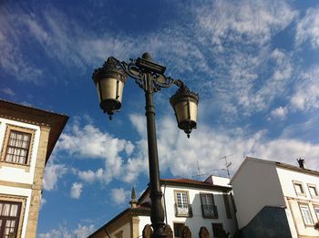 Low angle view of lamp post and built structures